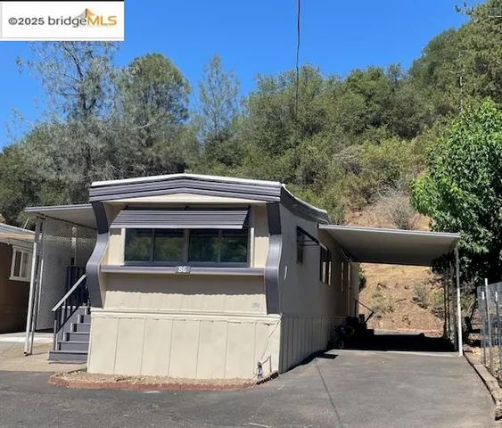 a view of house and outdoor space with seating area