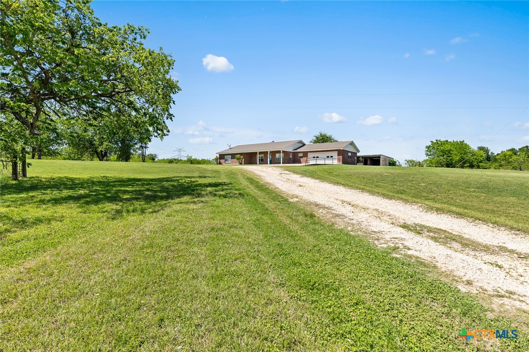 10514 Hunt Hill Road Rogers, TX 76569 - Photo 11 of 46 a view of a big yard with a large trees