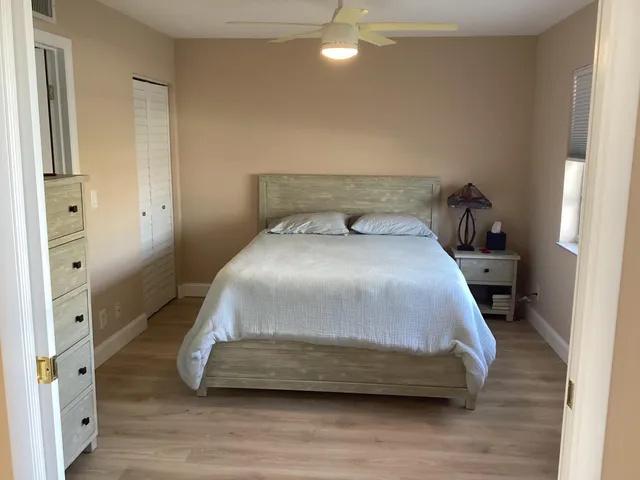 a bedroom with a bed and a walk in closet