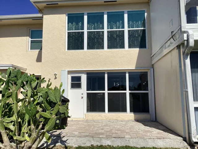 an outdoor sitting area with lake view