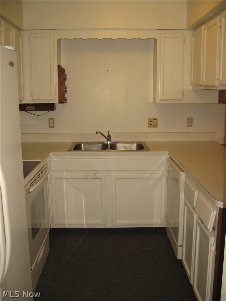 2276 Raber Road, Unit A Uniontown, OH 44685 - Photo 4 of 24 GALLEY KITCHEN - APPLS ESTIMATED AT 4 YRS OLD
