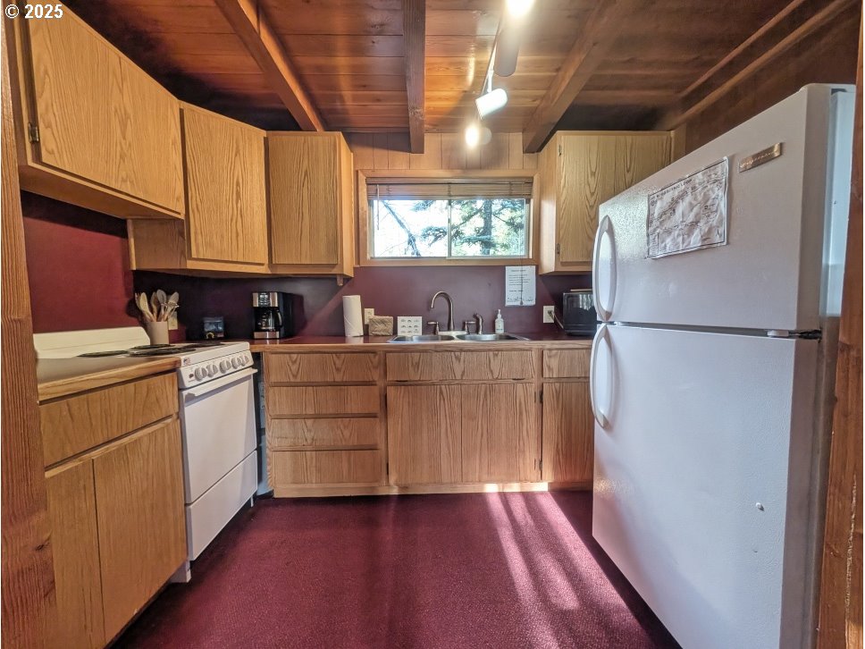 89255 Government Camp Loop Government Camp, OR 97028 - Photo 11 of 37 a kitchen with refrigerator and cabinets