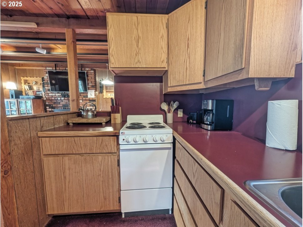 89255 Government Camp Loop Government Camp, OR 97028 - Photo 13 of 37 a kitchen with cabinets and appliances