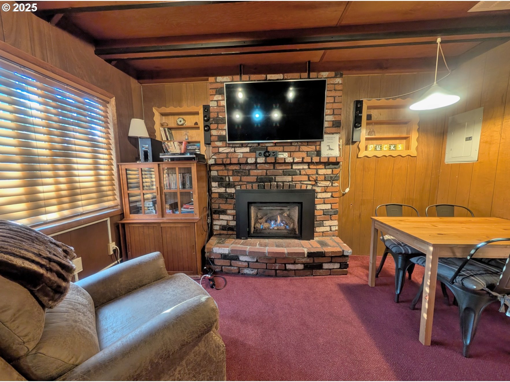 89255 Government Camp Loop Government Camp, OR 97028 - Photo 4 of 37 a living room with furniture a flat screen tv and a fireplace