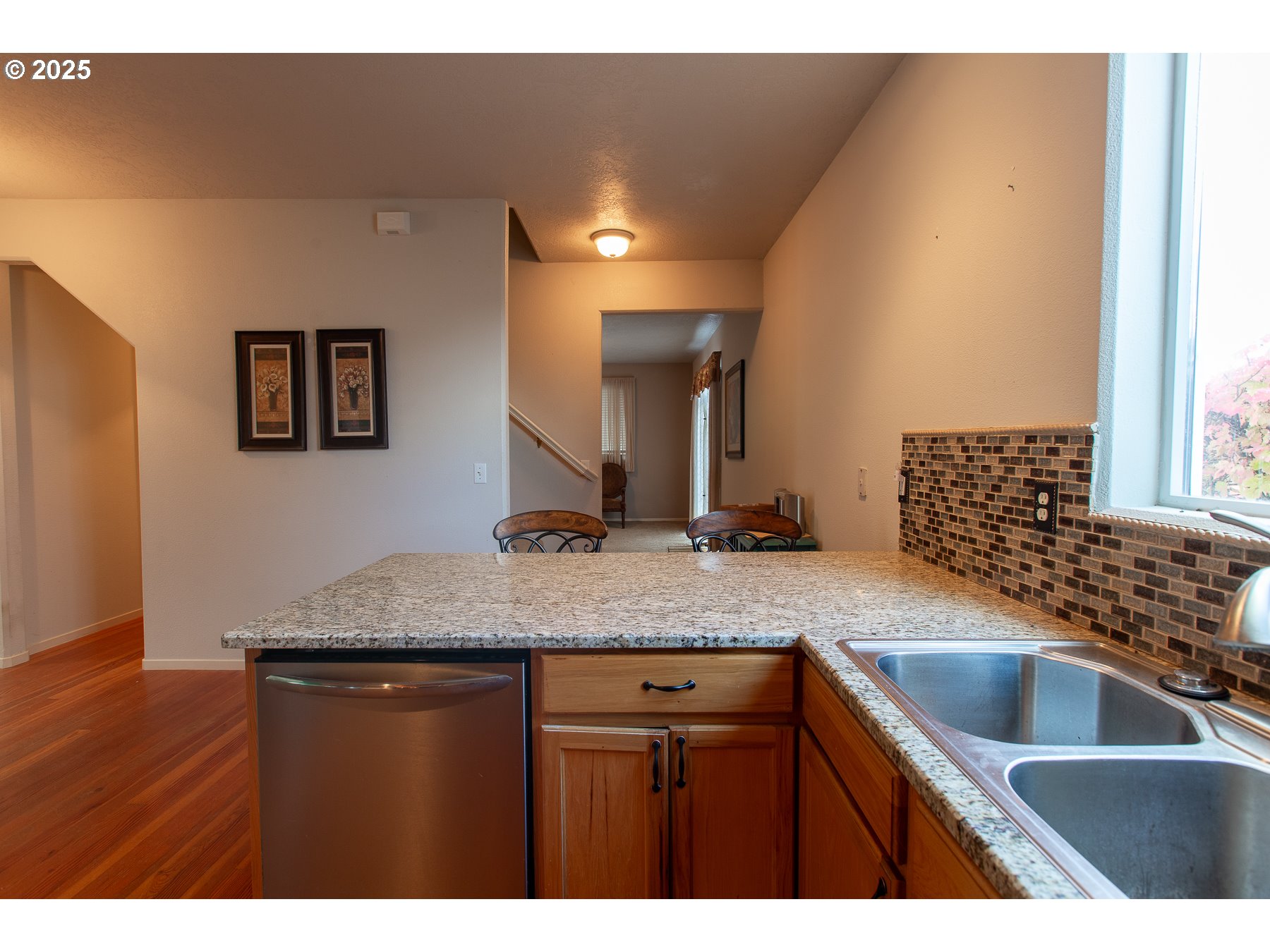 6964 Bluebelle Way Springfield, OR 97478 - Photo 11 of 35 a kitchen with a sink a counter top space and cabinets