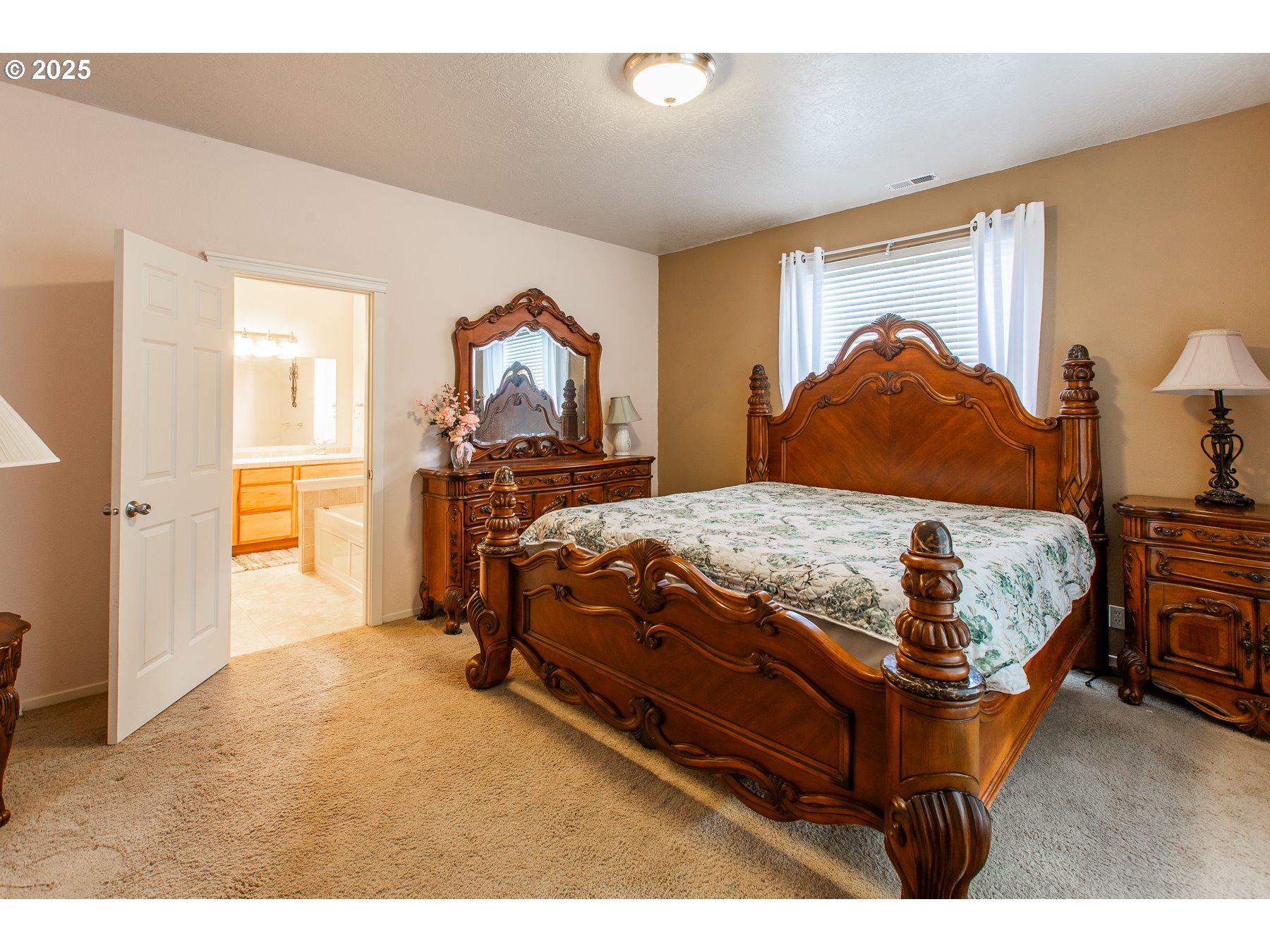 6964 Bluebelle Way Springfield, OR 97478 - Photo 16 of 35 a bedroom with a bed and dresser