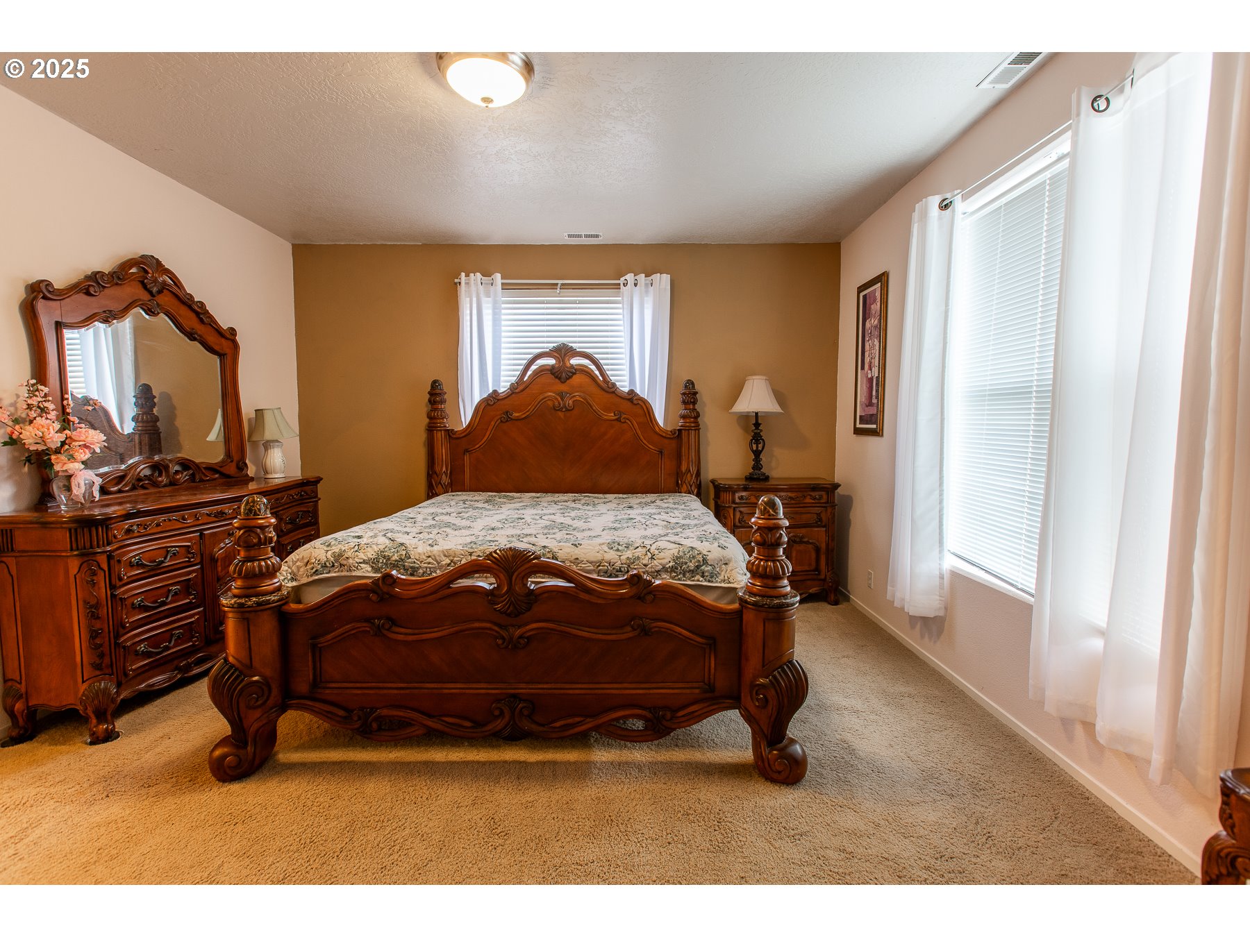 6964 Bluebelle Way Springfield, OR 97478 - Photo 17 of 35 a bedroom with a bed and wooden floor