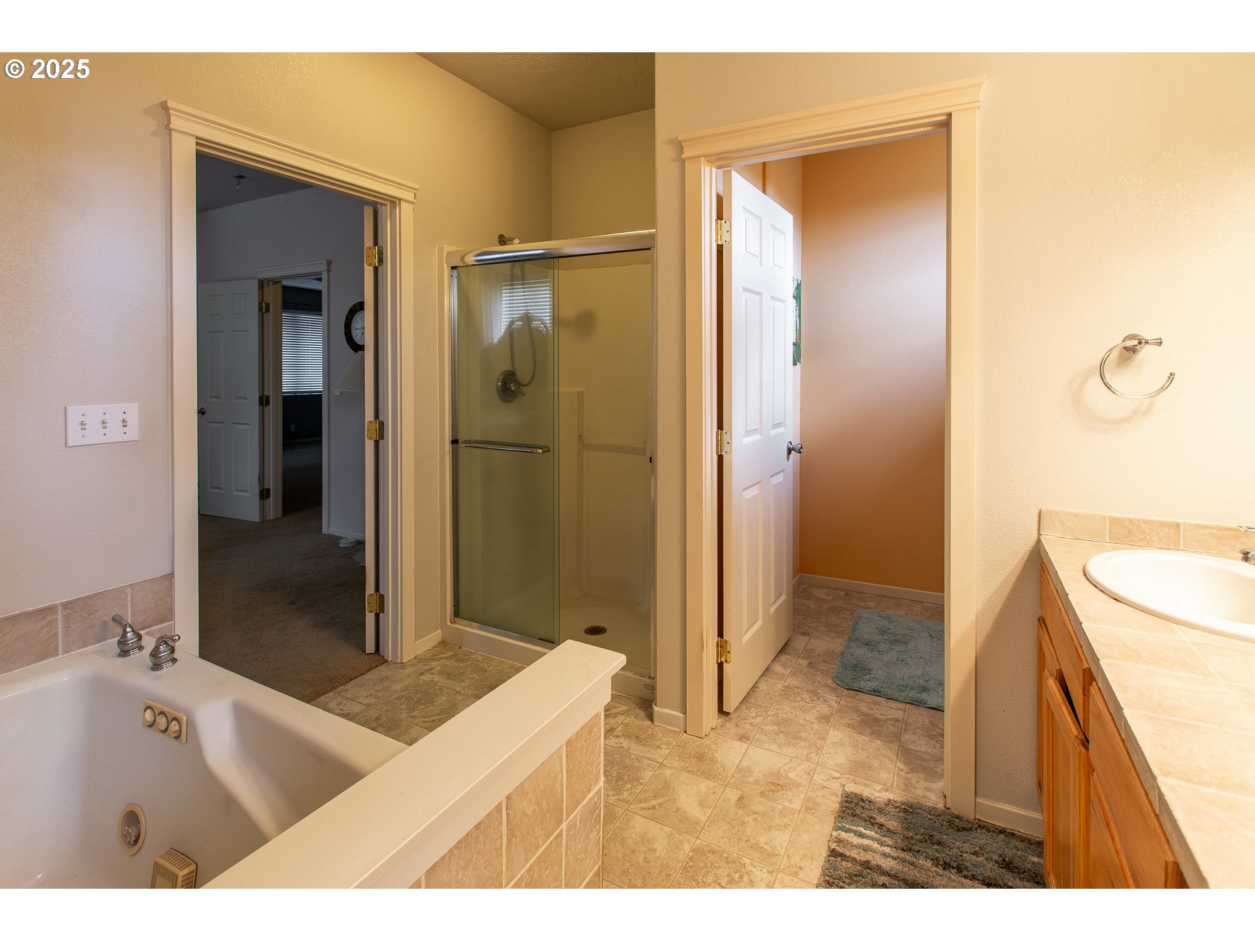 6964 Bluebelle Way Springfield, OR 97478 - Photo 19 of 35 a bathroom with a tub sink and shower