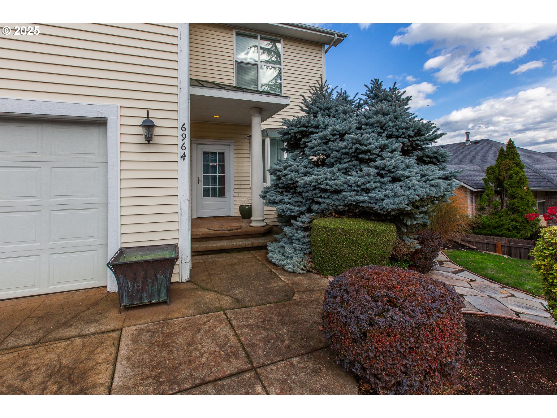 6964 Bluebelle Way Springfield, OR 97478 - Photo 2 of 35 a backyard of a house with barbeque oven and a fire pit