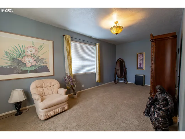a view of a livingroom with furniture and window