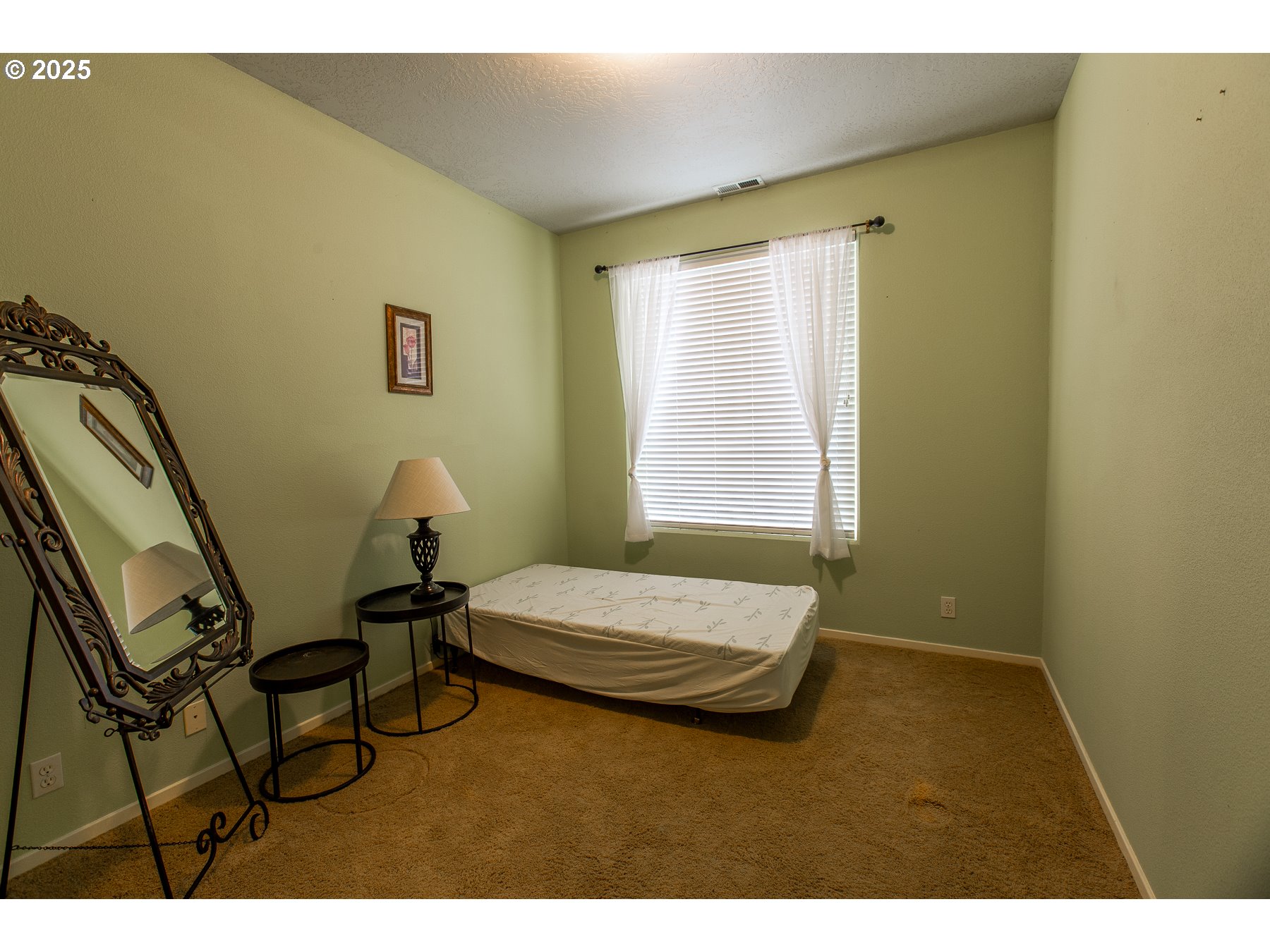 6964 Bluebelle Way Springfield, OR 97478 - Photo 24 of 35 a bedroom with a bed and a window