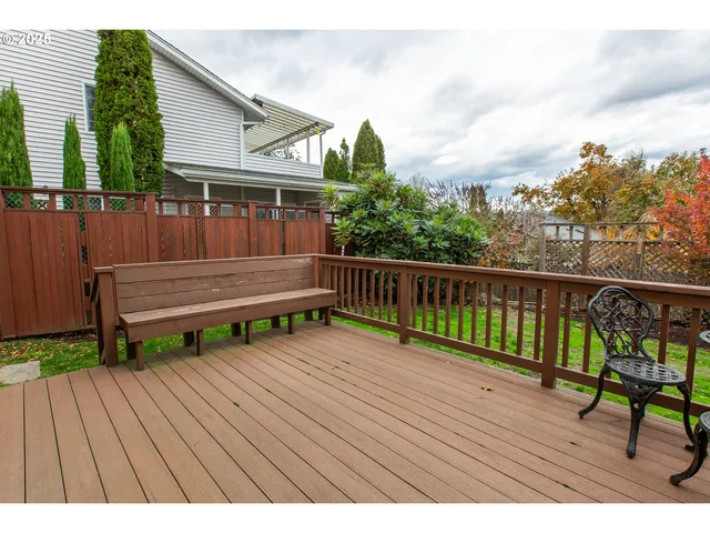 a view of a balcony with wooden floor