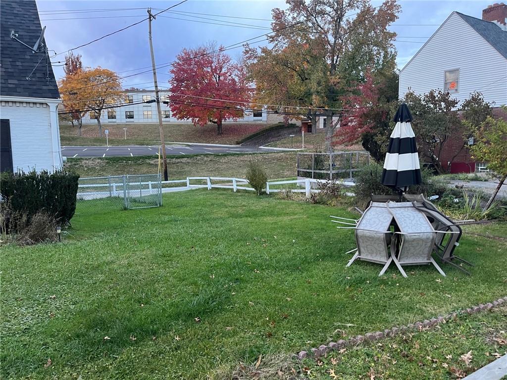 4914 McAnulty Road Pittsburgh, PA 15236 - Photo 16 of 17 a backyard of a house with table and chairs