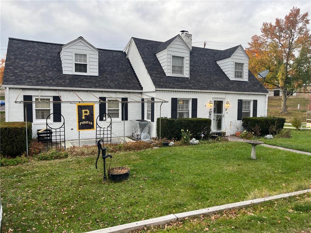 4914 McAnulty Road Pittsburgh, PA 15236 - Photo 17 of 17 a front view of a house with a yard table and chairs