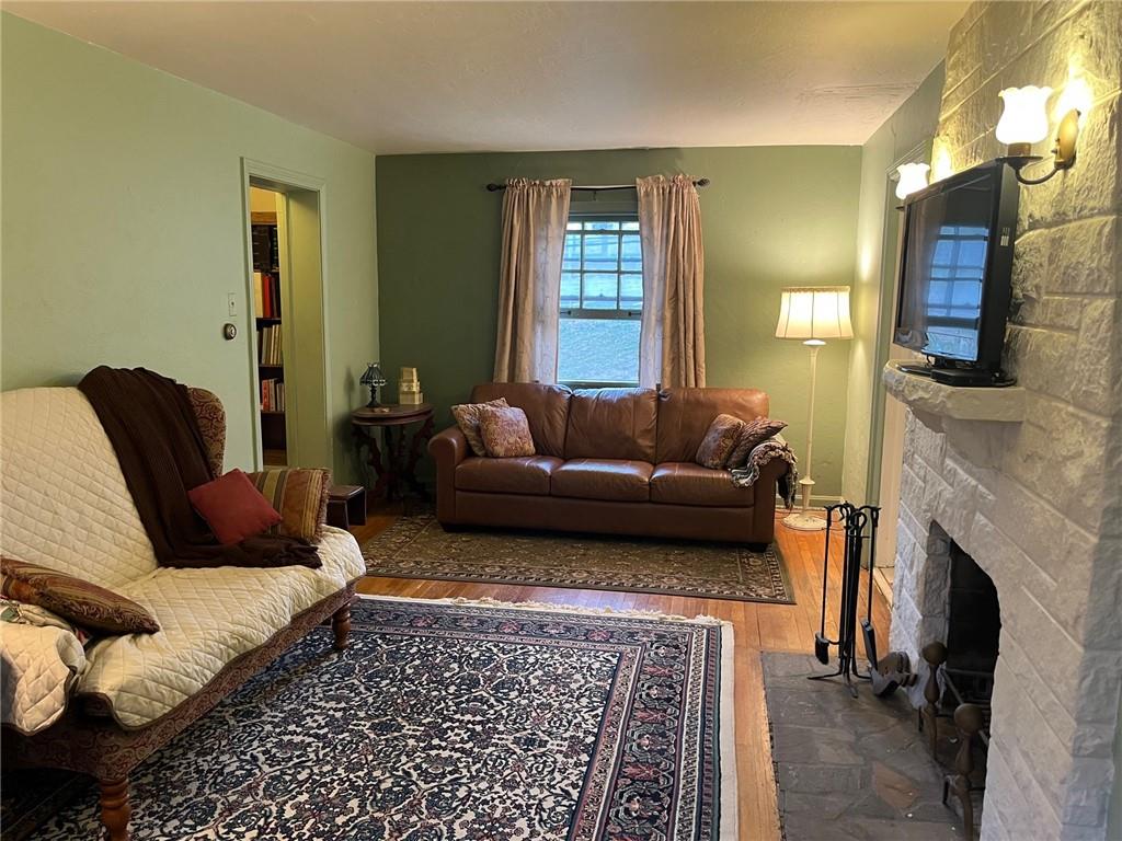 4914 McAnulty Road Pittsburgh, PA 15236 - Photo 4 of 17 a living room with furniture and a fireplace