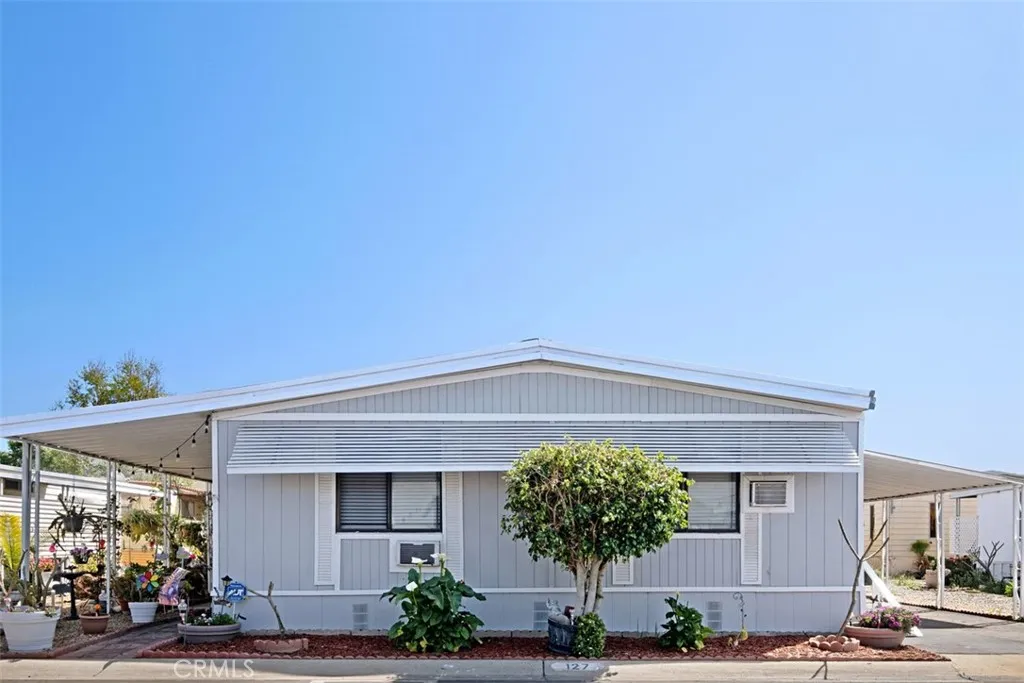 3700 Buchanan Street, Unit 127 Riverside, CA 92503 - Photo 1 of 1 a front view of a house with a yard