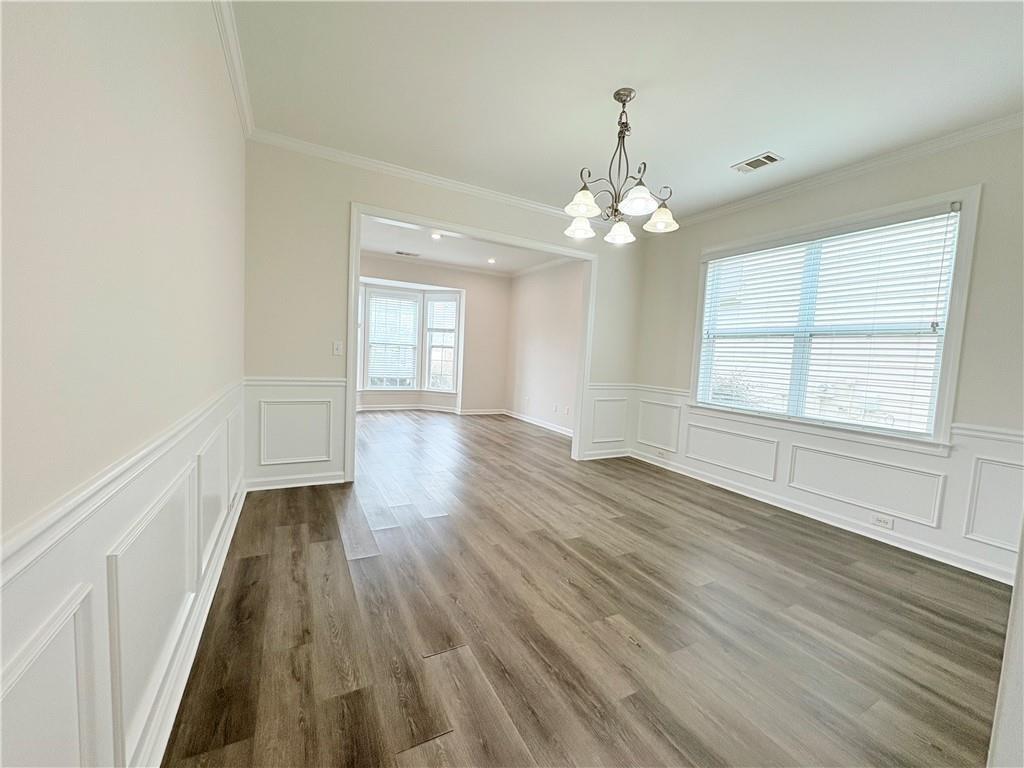 4195 Settlers Grove Road Cumming, GA 30028 - Photo 13 of 38 wooden floor in an empty room with a window