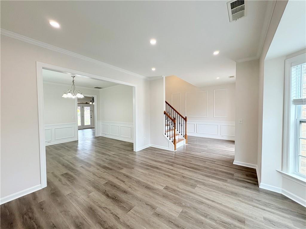 4195 Settlers Grove Road Cumming, GA 30028 - Photo 14 of 38 a view of a hallway with wooden floor