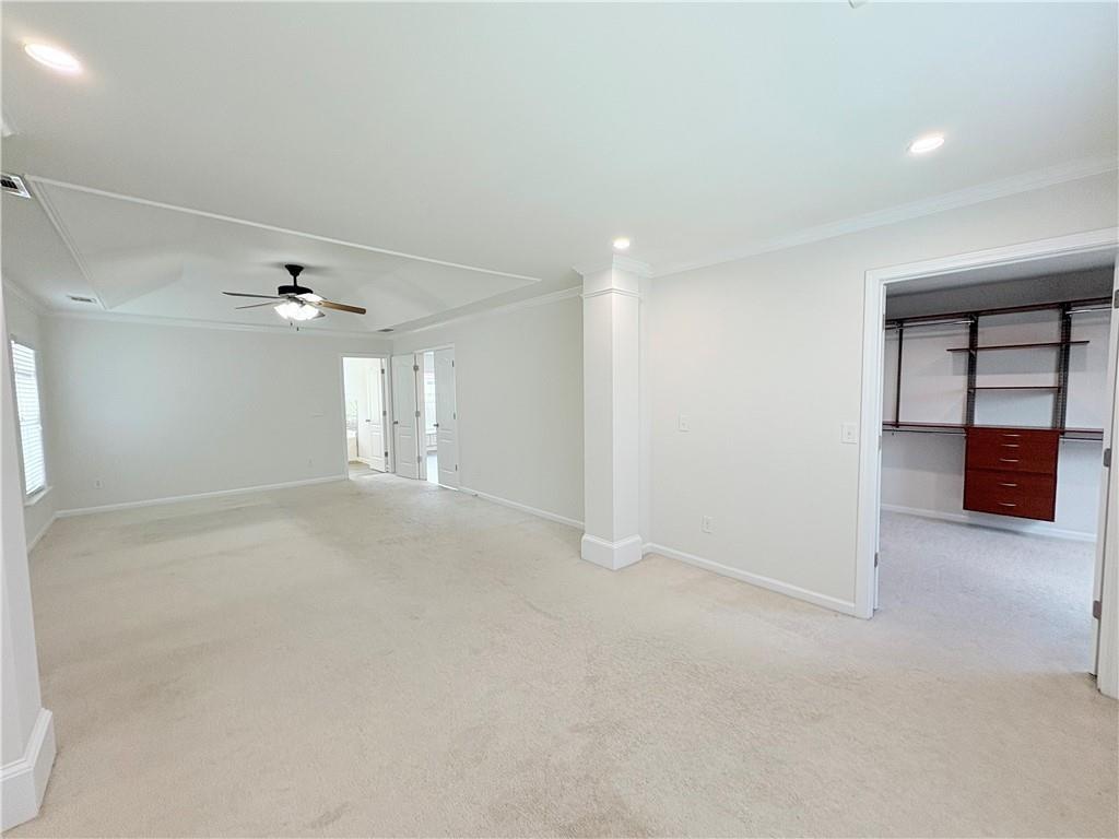 4195 Settlers Grove Road Cumming, GA 30028 - Photo 16 of 38 wooden floor in an empty room with a ceiling fan