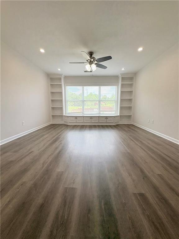 4195 Settlers Grove Road Cumming, GA 30028 - Photo 19 of 38 an empty room with wooden floor and windows