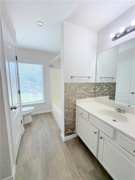 4195 Settlers Grove Road Cumming, GA 30028 - Photo 24 of 38 a bathroom with a sink a mirror and a shower