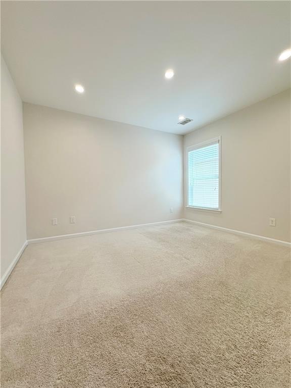 4195 Settlers Grove Road Cumming, GA 30028 - Photo 27 of 38 an empty room with windows