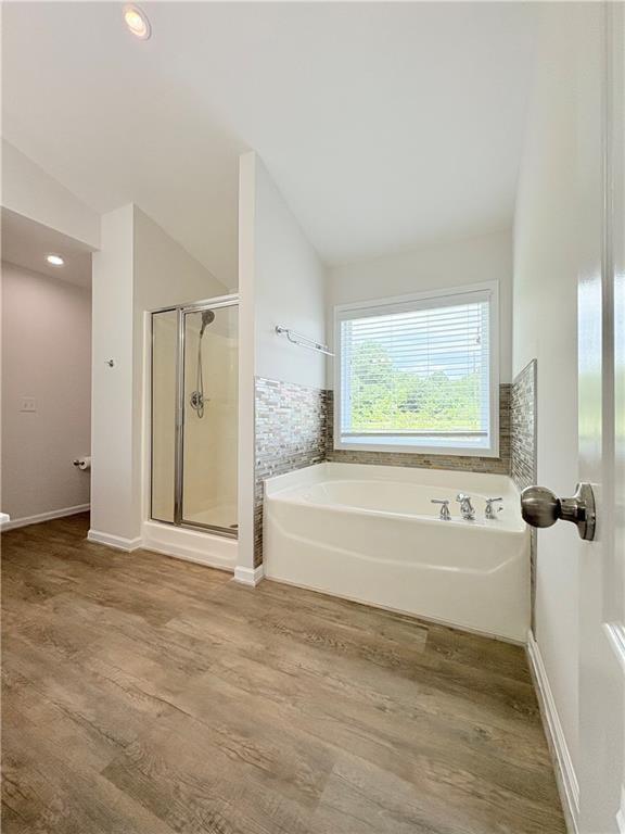 4195 Settlers Grove Road Cumming, GA 30028 - Photo 31 of 38 a spacious bathroom with a bathtub and a shower
