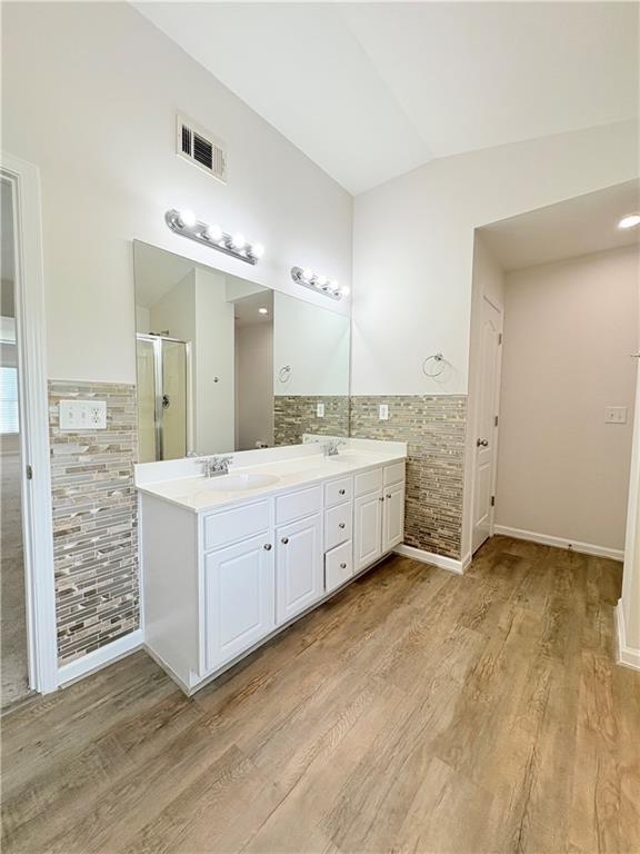 4195 Settlers Grove Road Cumming, GA 30028 - Photo 32 of 38 a view of a double vanity sink mirror and cabinets
