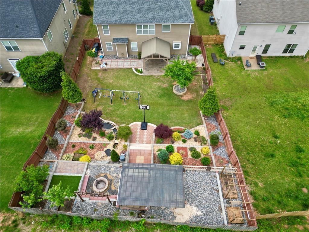 4195 Settlers Grove Road Cumming, GA 30028 - Photo 33 of 38 an aerial view of a house with swimming pool and garden