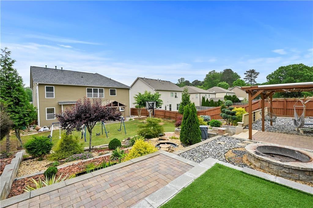 4195 Settlers Grove Road Cumming, GA 30028 - Photo 34 of 38 a view of house and outdoor space