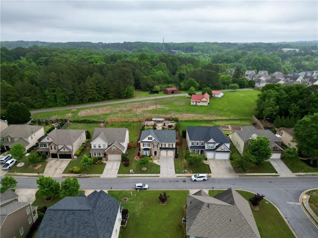 4195 Settlers Grove Road Cumming, GA 30028 - Photo 36 of 38 an aerial view of a house with a garden