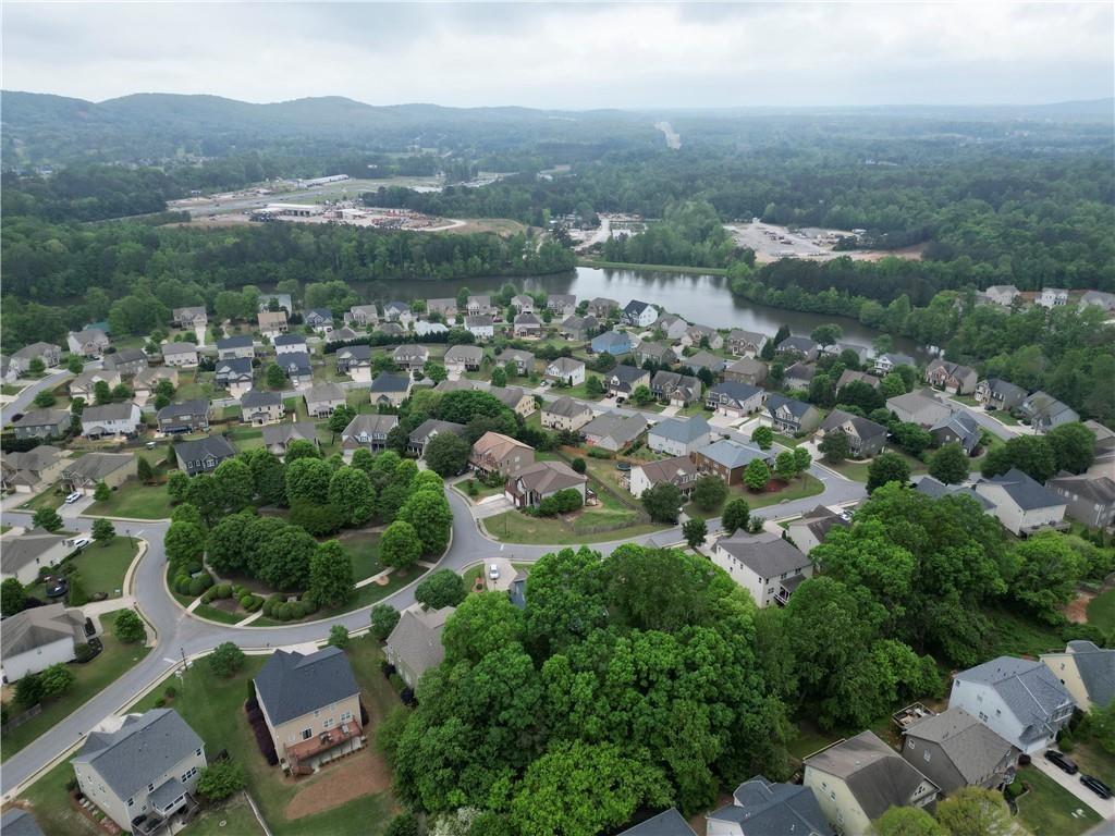 4195 Settlers Grove Road Cumming, GA 30028 - Photo 38 of 38 an aerial view of residential houses with outdoor space and trees
