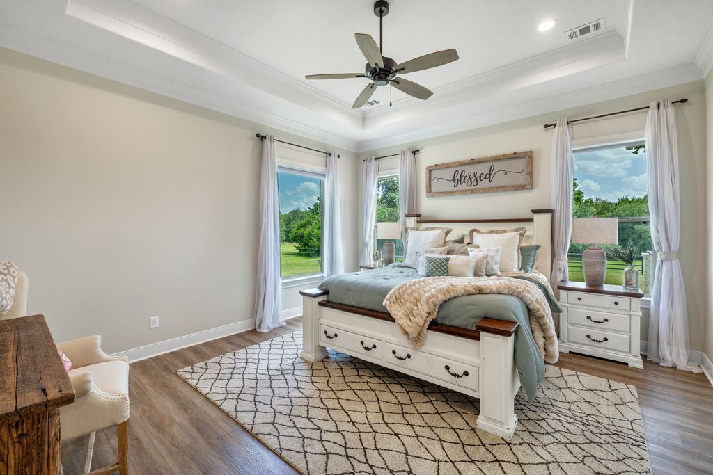 7650 Rolling Creek Road Burton, TX 77835 - Photo 11 of 22 a bedroom with a bed and a window