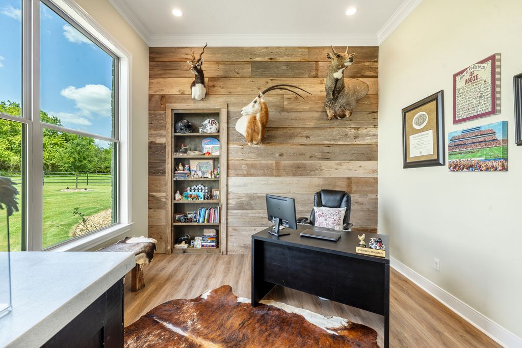 7650 Rolling Creek Road Burton, TX 77835 - Photo 13 of 22 a living room with fireplace furniture and a floor to ceiling window
