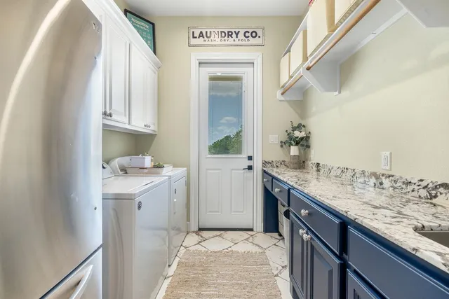 a dining room with furniture and a floor to ceiling window
