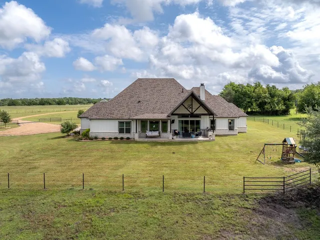 a backyard of a house with lots of green space
