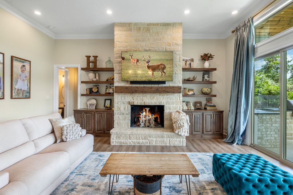 7650 Rolling Creek Road Burton, TX 77835 - Photo 4 of 22 a living room with furniture and a fireplace