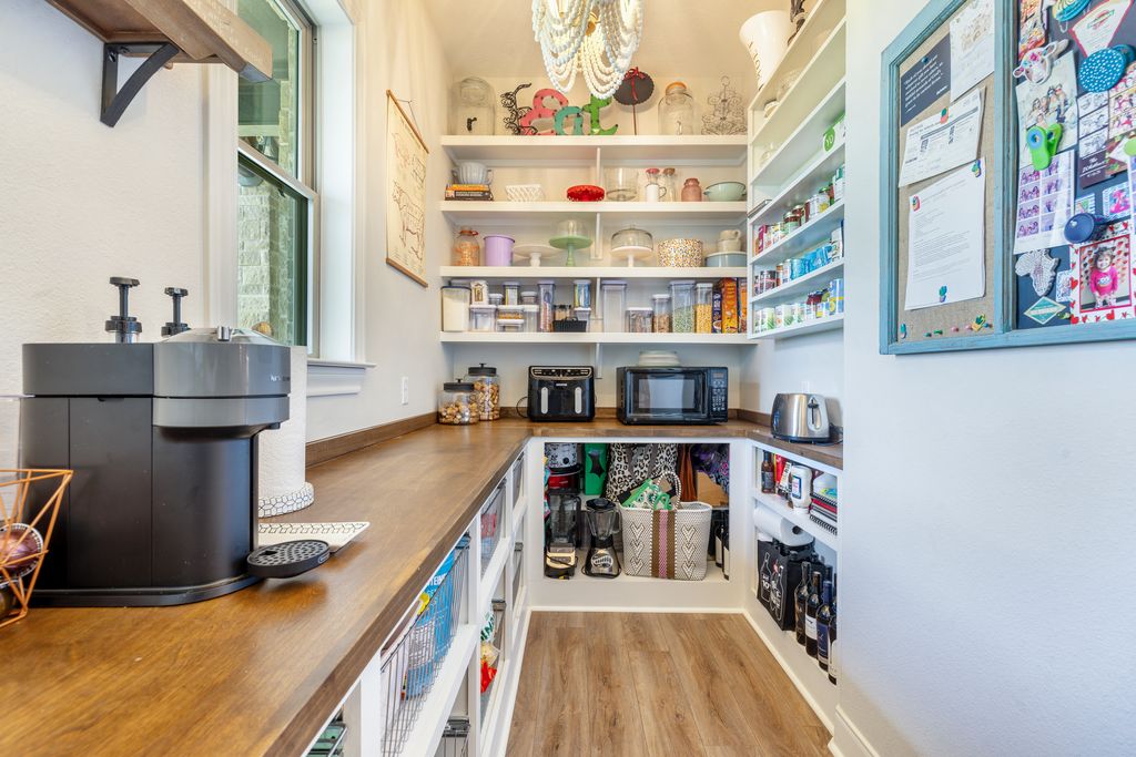 7650 Rolling Creek Road Burton, TX 77835 - Photo 8 of 22 The pantry is a spacious room that not only offers ample storage for food and decor, but also lends to aesthetic appeal.