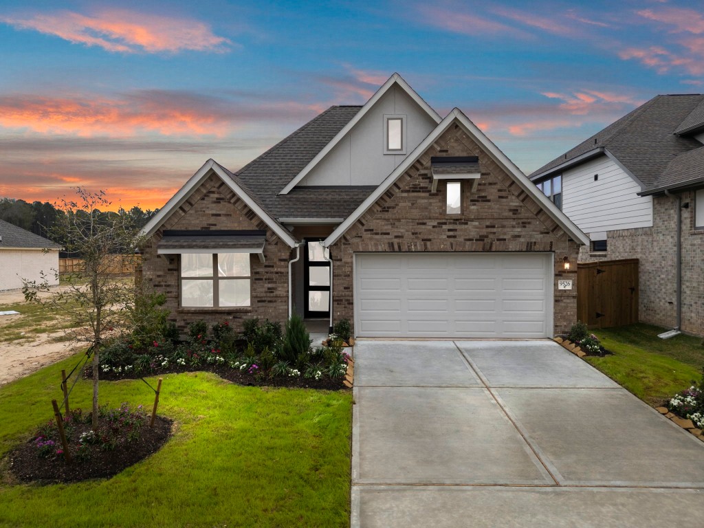 9526 Sierra Crest Lane Porter, TX 77365 - Photo 1 of 39 a front view of a house with a yard