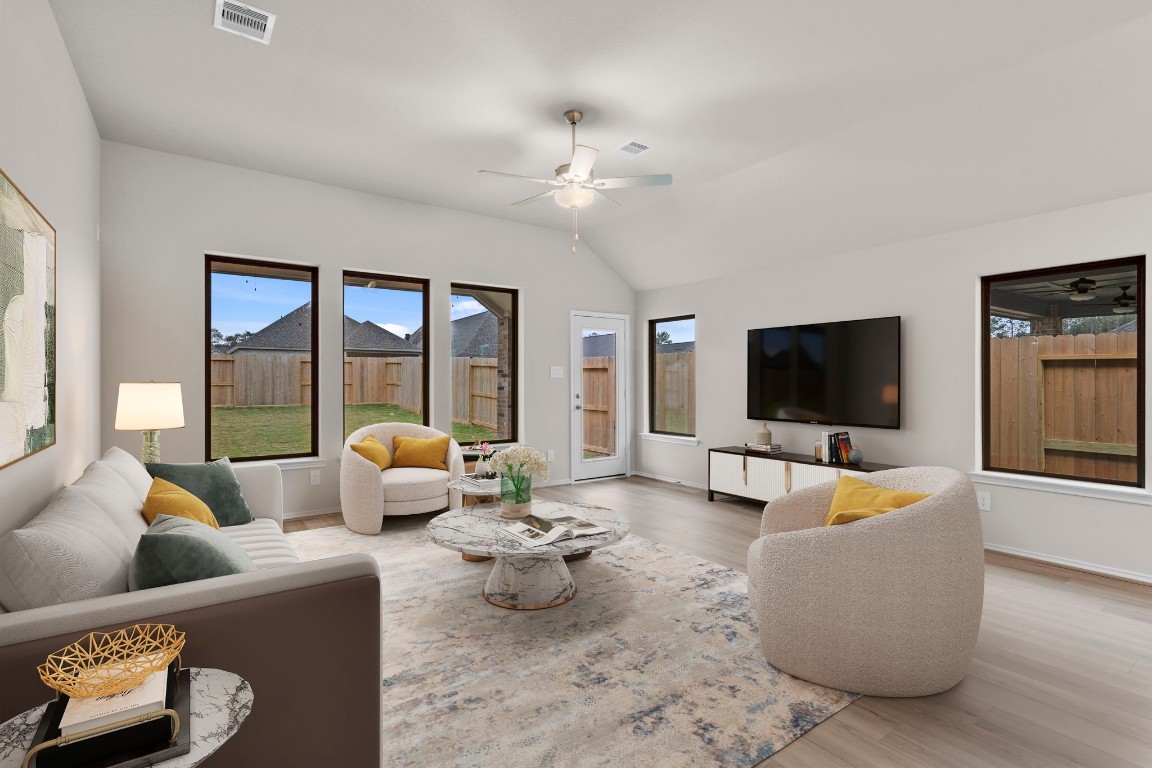 9526 Sierra Crest Lane Porter, TX 77365 - Photo 11 of 39 a living room with furniture and a flat screen tv
