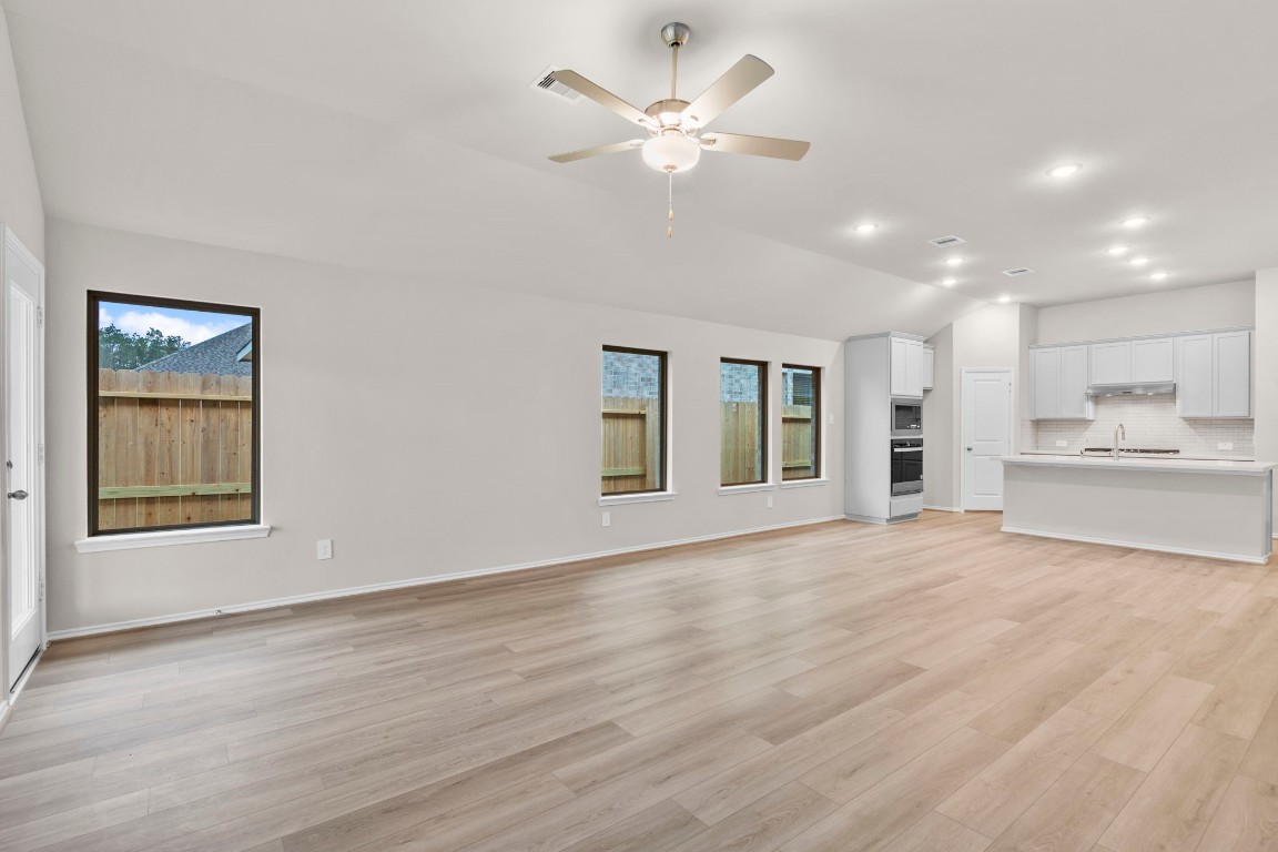9526 Sierra Crest Lane Porter, TX 77365 - Photo 13 of 39 a view of an empty room with window and wooden floor