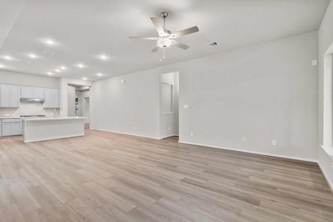 9526 Sierra Crest Lane Porter, TX 77365 - Photo 14 of 39 a view of an empty room with a kitchen