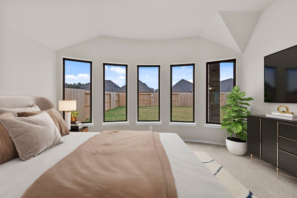 9526 Sierra Crest Lane Porter, TX 77365 - Photo 15 of 39 a spacious bedroom with a large bed and a large window