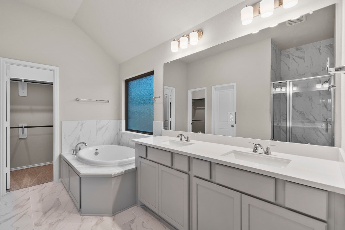 9526 Sierra Crest Lane Porter, TX 77365 - Photo 19 of 39 a bathroom with a double vanity sink mirror and