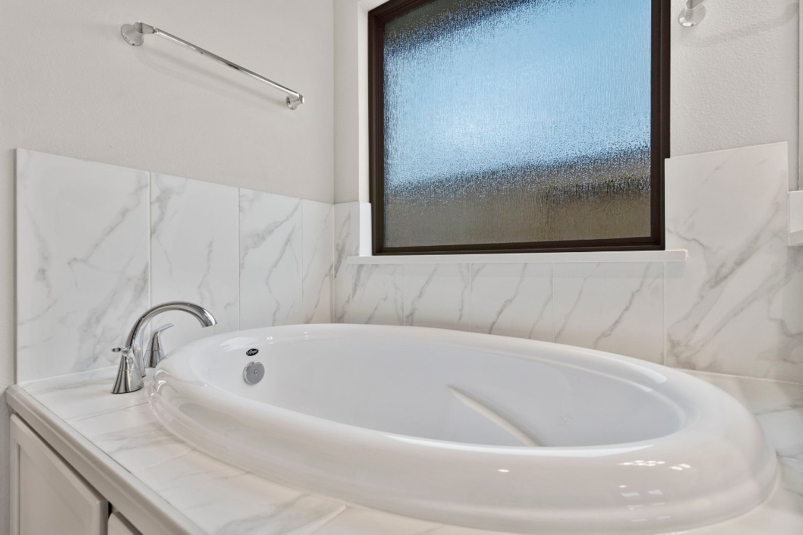 9526 Sierra Crest Lane Porter, TX 77365 - Photo 23 of 39 a white bath tub sitting next to a white sink