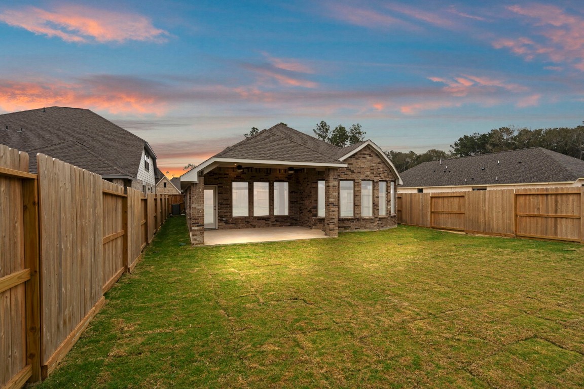 9526 Sierra Crest Lane Porter, TX 77365 - Photo 25 of 39 a view of a house with a swimming pool and deck