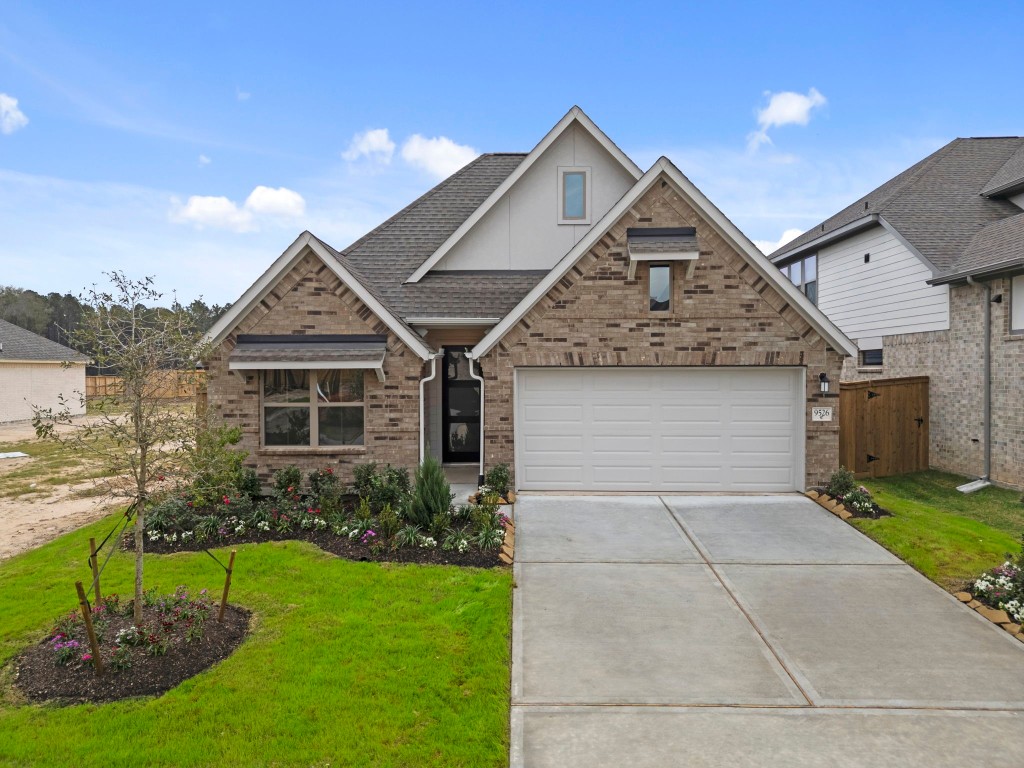 9526 Sierra Crest Lane Porter, TX 77365 - Photo 27 of 39 a front view of a house with a yard