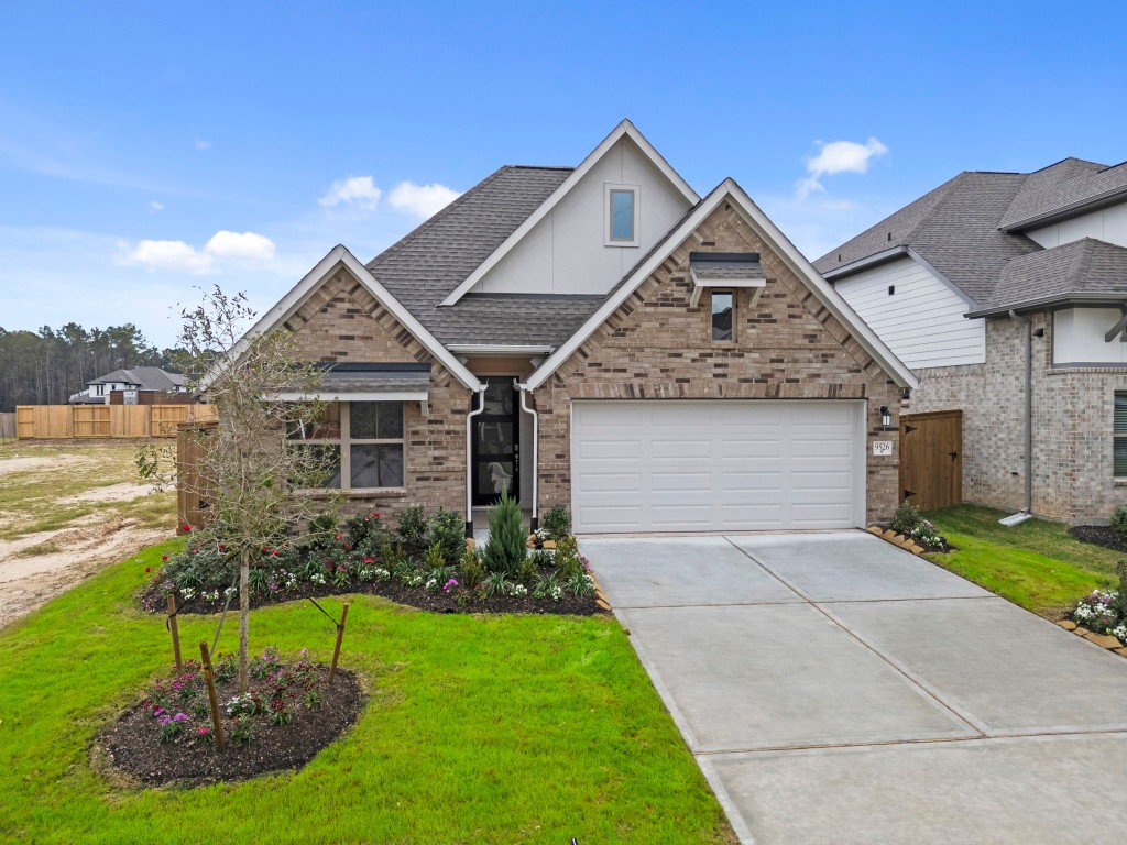 9526 Sierra Crest Lane Porter, TX 77365 - Photo 28 of 39 a front view of a house with a yard