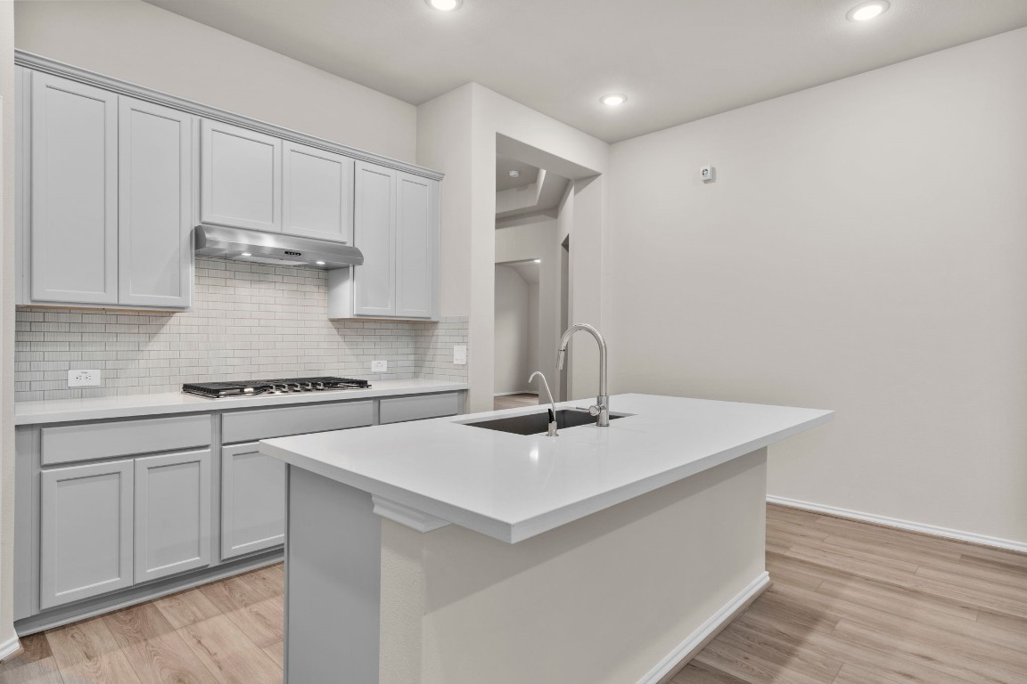 9526 Sierra Crest Lane Porter, TX 77365 - Photo 7 of 39 a kitchen with a sink cabinets and appliances