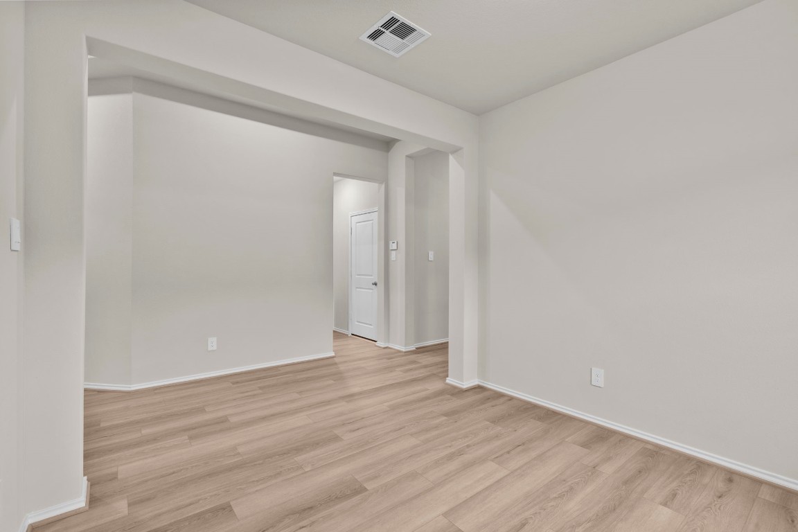 9526 Sierra Crest Lane Porter, TX 77365 - Photo 9 of 39 a view of an empty room with wooden floor